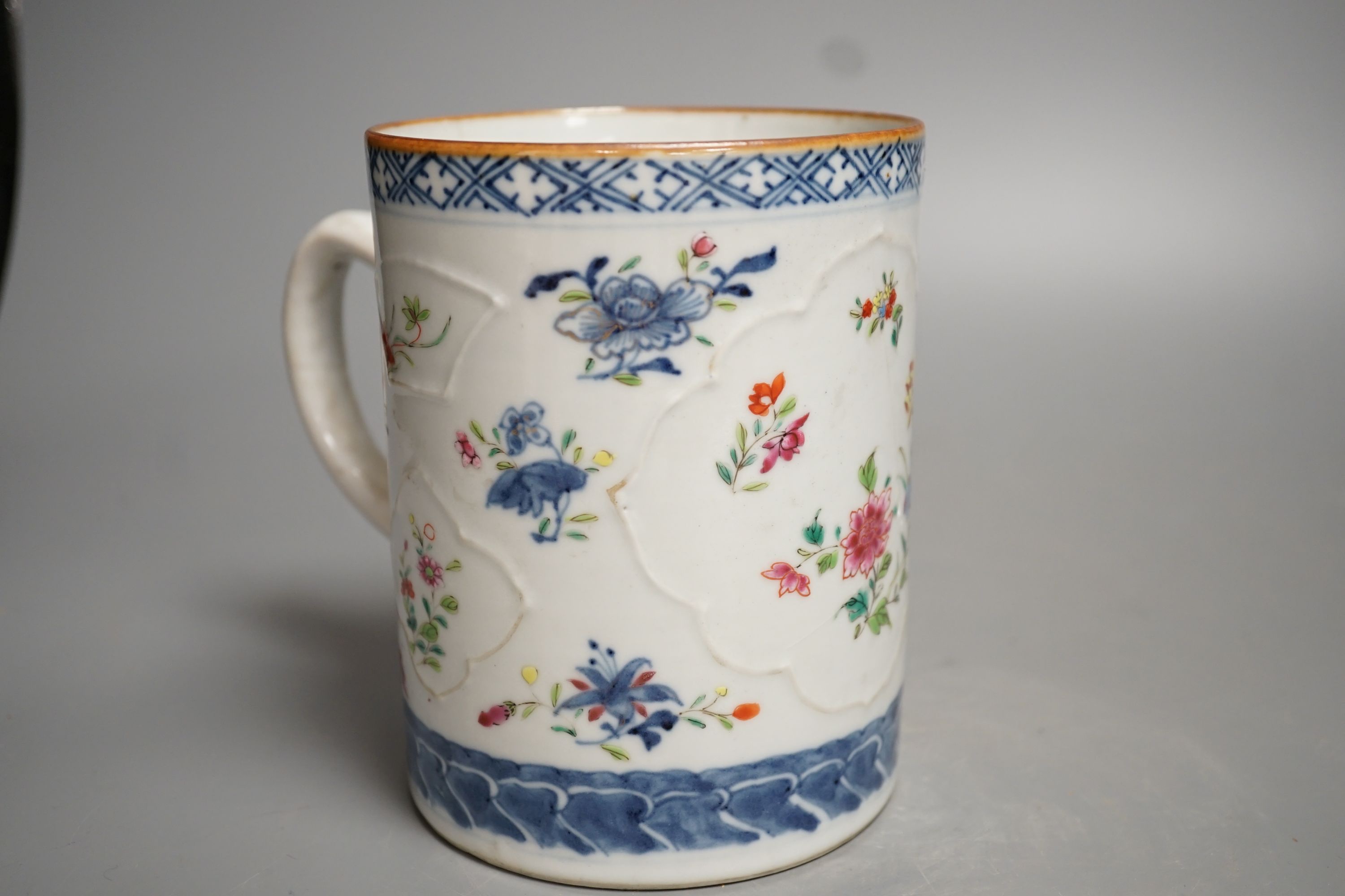 An 18th-century Chinese export mug, 15cm high, two similar plates, four 20th century Chinese dragon plates and a soapstone vase